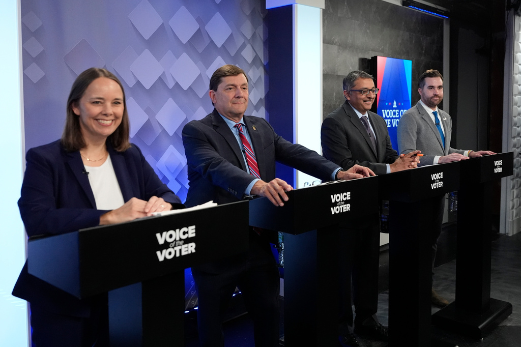 From left, U.S. Senate candidates Shenna Bellows, Troy Jackson, Dr. Nirav Shah, and Jordan Wood prepare for their televised debate at the WCSH-6 studio Thursday, July 16, 2026, in Portland, Maine. (AP Photo/Robert F. Bukaty)