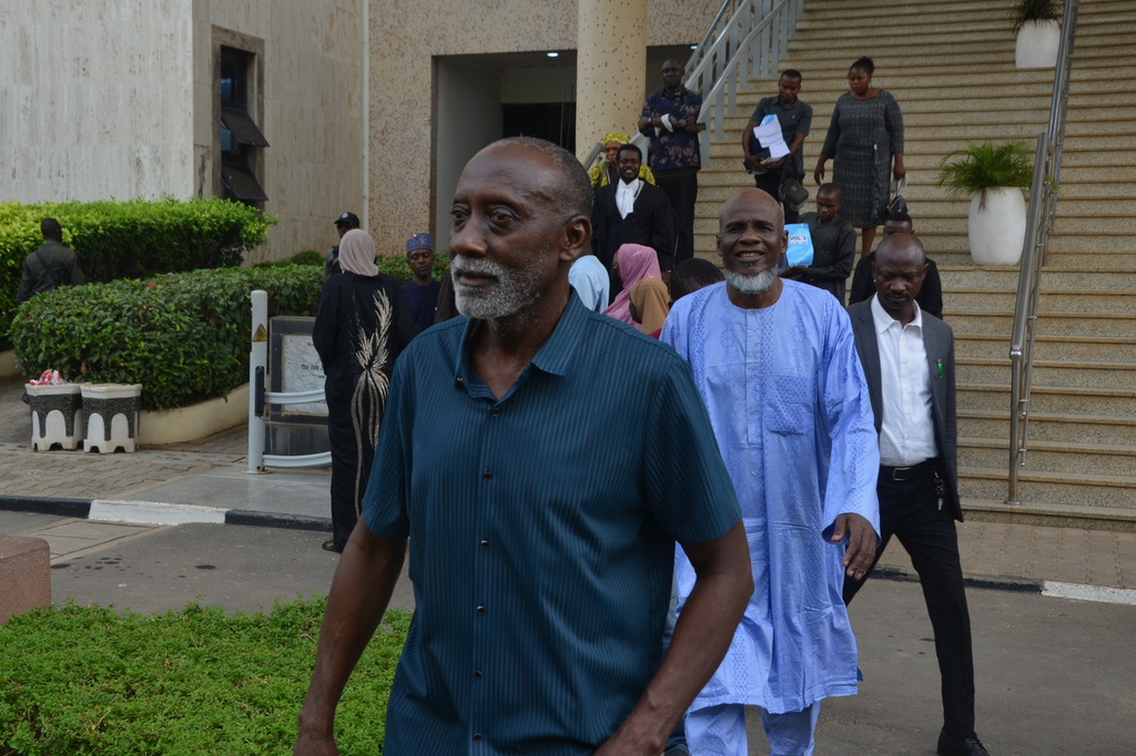 People accused of plotting to overthrow Nigerian President Bola Tinubu arrive at the federal high court in Abuja, Nigeria, Wednesday, April 22, 2026. (AP Photo/Gbemiga Olamikan)