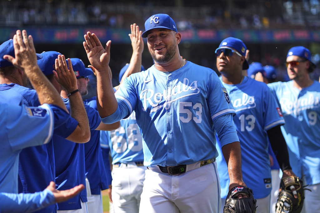 Kansas City Royals' Carlos Estevez (53) celebrates with teammates after their baseball game against the Chicago White Sox, Sunday, Aug. 17, 2025, in Kansas City, Mo. (AP Photo/Charlie Riedel)