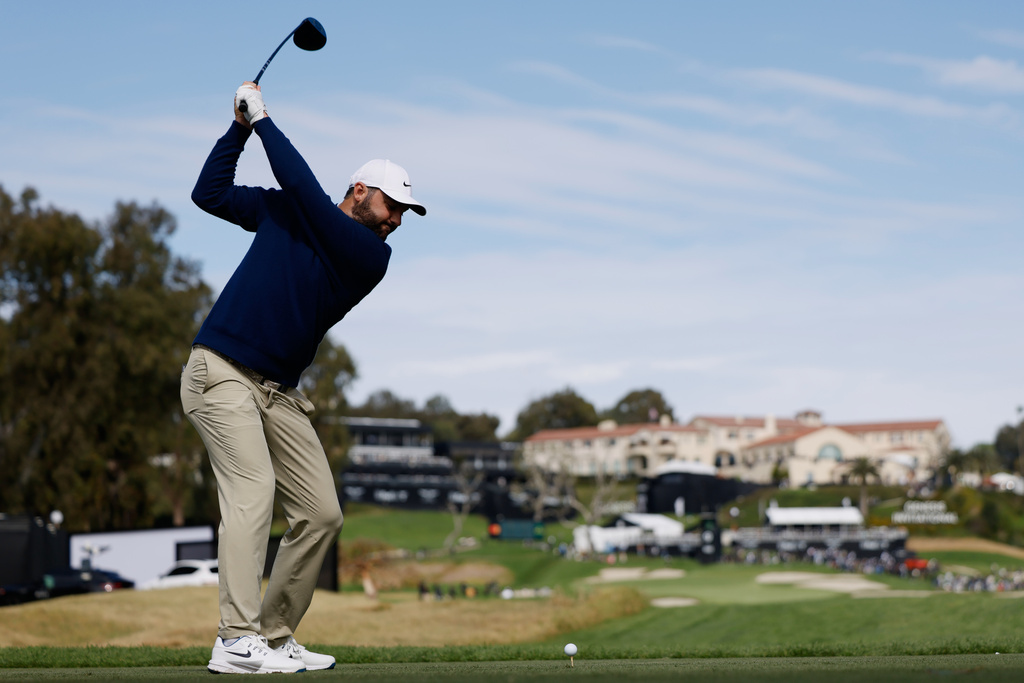 Scottie Scheffler hits from the ninth tee during the second round of the Genesis Invitational golf tournament at Riviera Country Club, Friday, Feb. 20, 2026, in the Pacific Palisades area of Los Angeles. (AP Photo/Caroline Brehman)