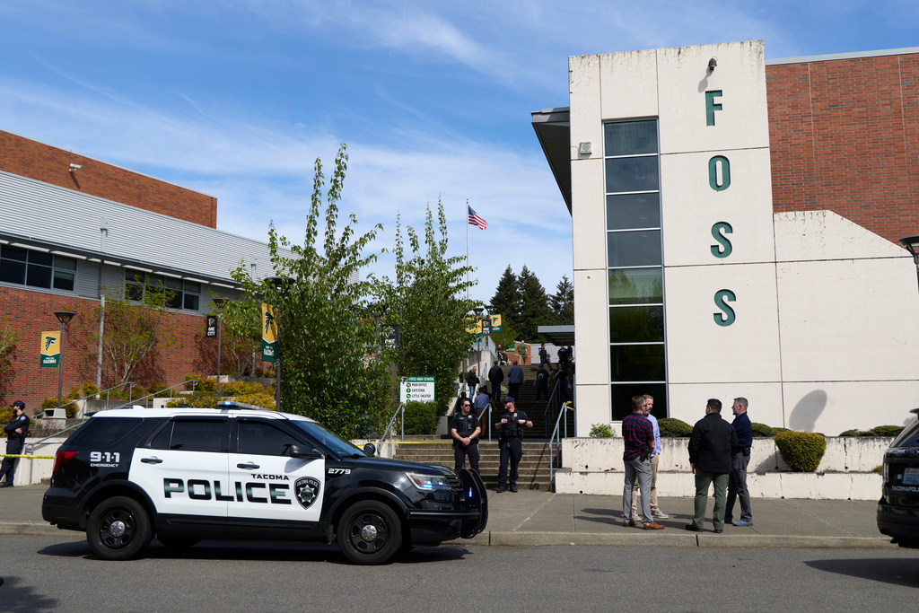 Tacoma Police officers investigate after multiple people were injured in a stabbing at Foss High School, Thursday, April 30, 2026, in Tacoma, Wash. (AP Photo/John Froschauer)