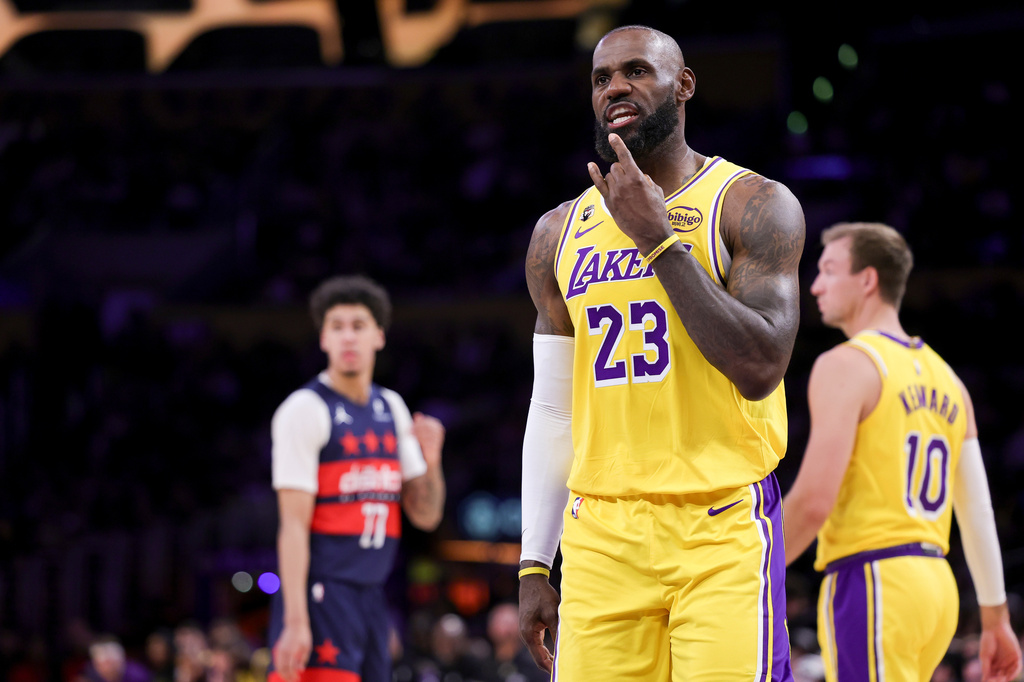 Los Angeles Lakers forward LeBron James gestures during the first half of an NBA basketball game against the Washington Wizards Monday, March 30, 2026, in Los Angeles. (AP Photo/Ryan Sun)