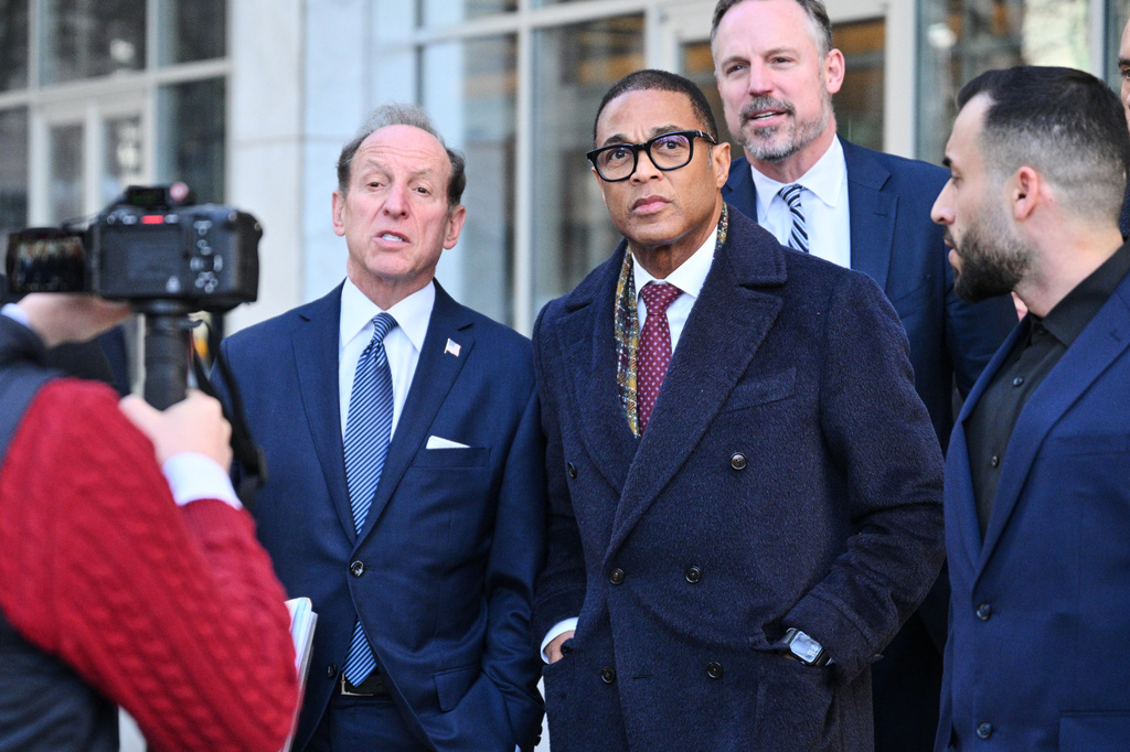 FILE - Journalist Don Lemon, center, exits the U.S. District Courthouse in St. Paul, Minn., Feb. 13, 2026. (AP Photo/Tom Baker, File)