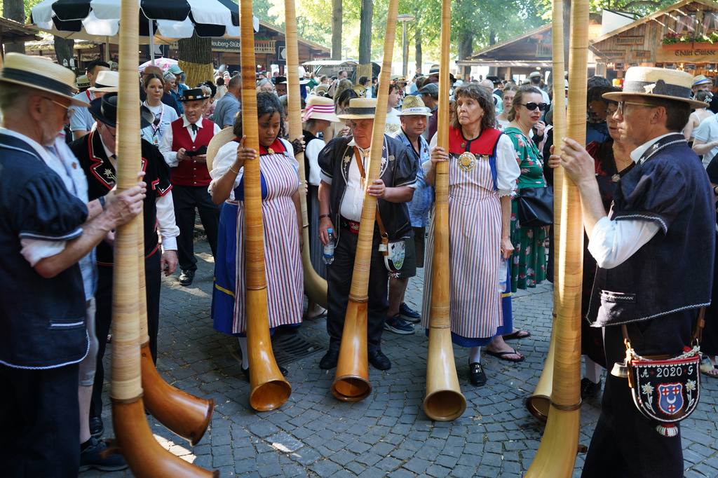 A group of Alpine Horn players stand at the Peters square in Basel, Switzerland, Saturday, June 27, 2026. (AP Photo/Jez Fielder)