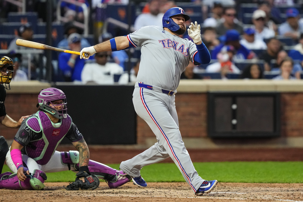 Texas Rangers' Rowdy Tellez (44) hits a double during the eighth inning of a baseball game against the New York Mets, Saturday, Sept. 13, 2025, in New York. (AP Photo/Yuki Iwamura)
