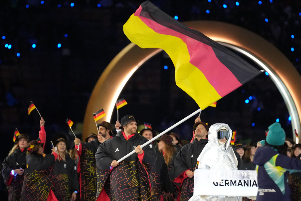 Leon Draisaitl, flag bearer of Germany arrives during the Olympic opening ceremony at the 2026 Winter Olympics, in Milan, Italy, Friday, Feb. 6, 2026. (AP Photo/Natacha Pisarenko)