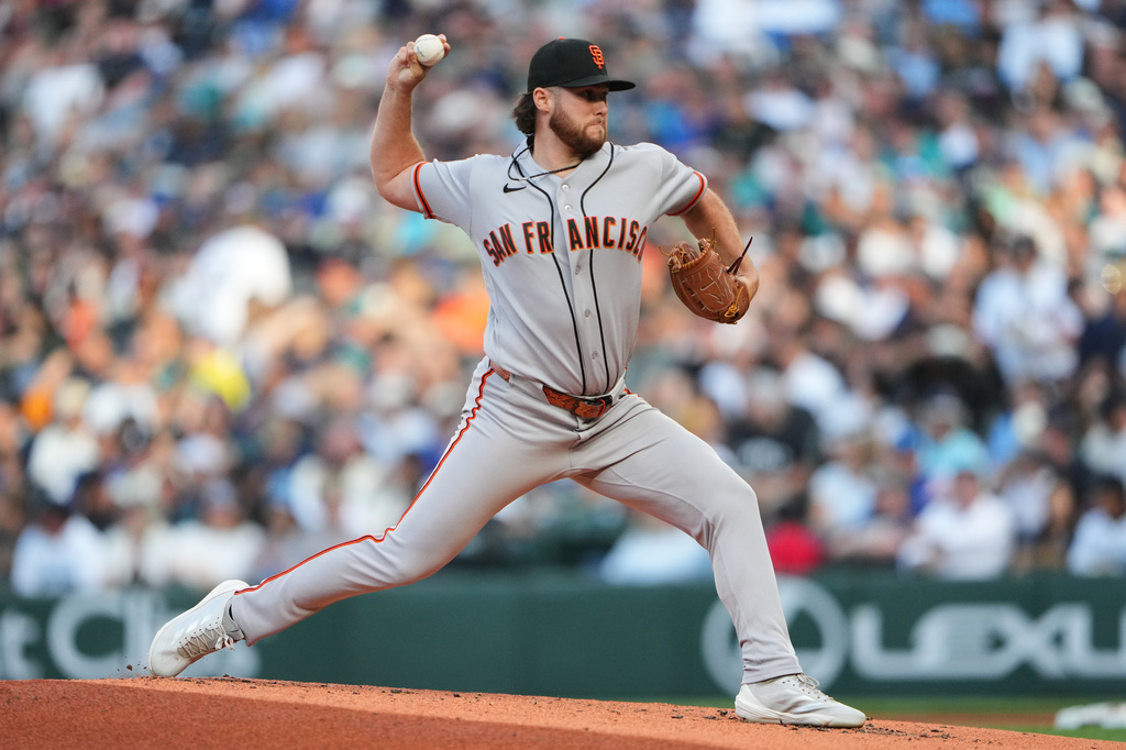 San Francisco Giants starting pitcher Landen Roupp throws against the Seattle Mariners during the first inning of a baseball game, Friday, July 17, 2026, in Seattle. (AP Photo/Lindsey Wasson)