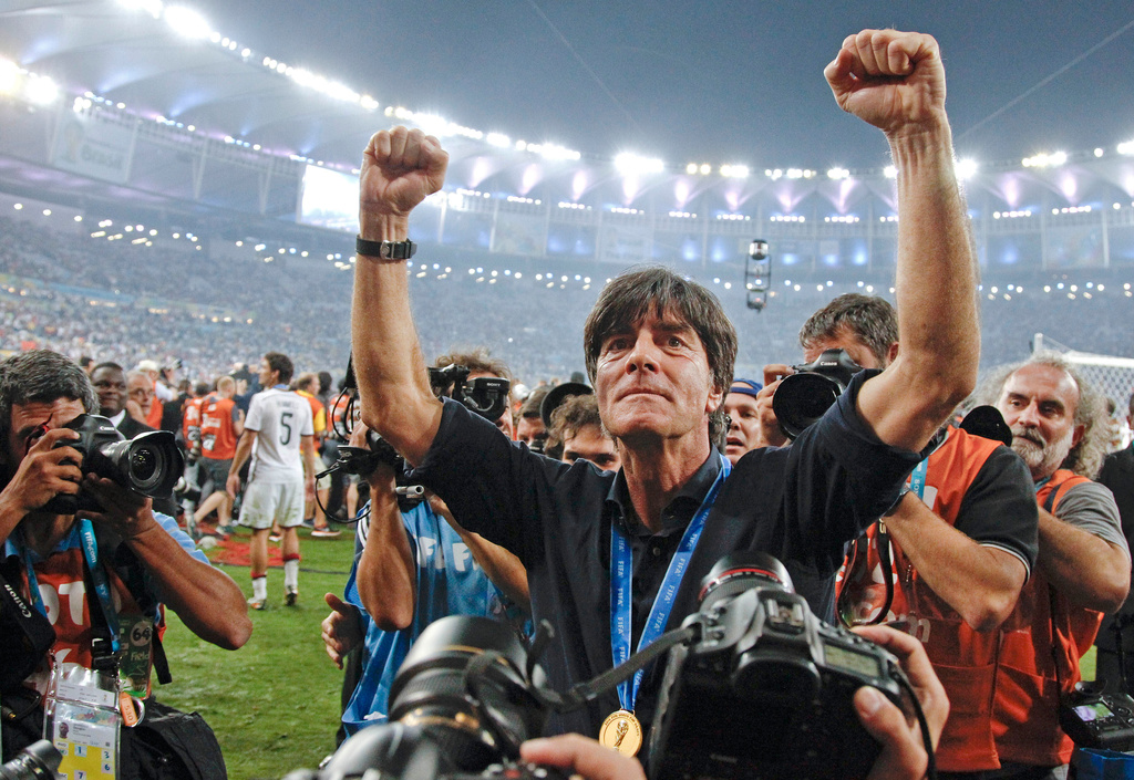 FILE - Germany's head coach Joachim Loew celebrates after the World Cup final soccer match between Germany and Argentina, July 13, 2014, at the Maracana Stadium in Rio de Janeiro, Brazil. (AP Photo/Matthias Schrader, File)