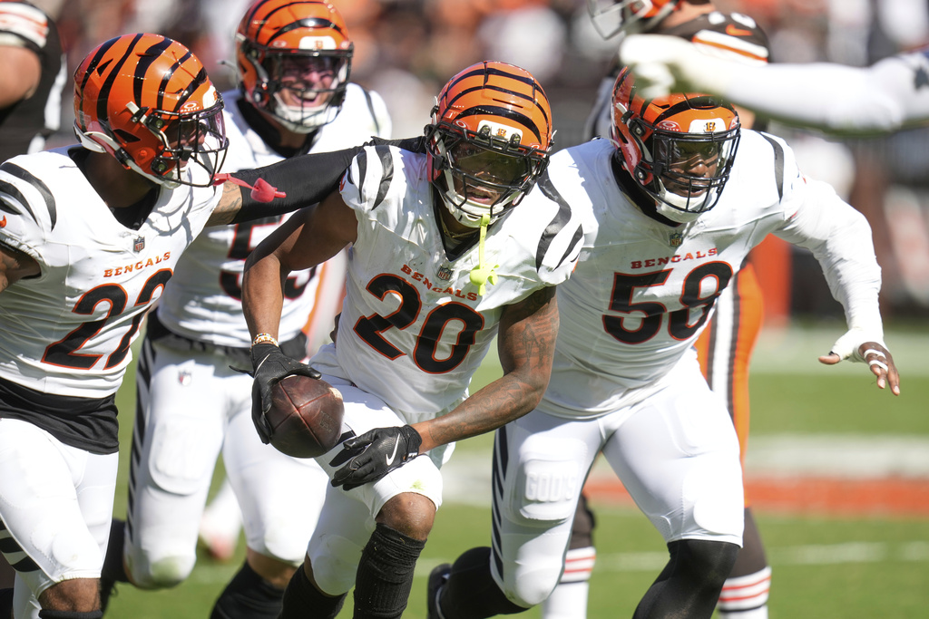 Cincinnati Bengals cornerback DJ Turner II (20) intercepts a pass during the second half of an NFL football game against the Cleveland Browns, Sunday, Sept. 7, 2025, in Cleveland. (AP Photo/Sue Ogrocki)