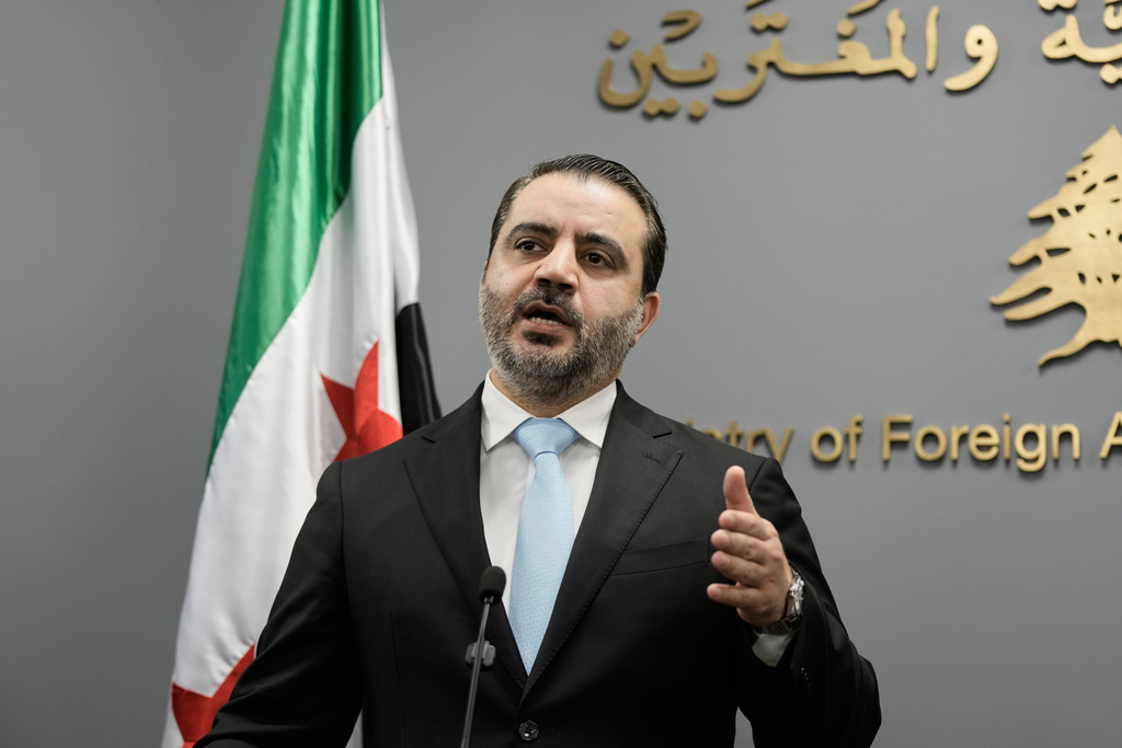 Syrian Foreign Minister Asaad al-Shibani speaks during a briefing for journalists after his meeting with Lebanese Foreign Minister Youssef Rajji in Beirut, Lebanon, Friday, Oct. 10, 2025. (AP Photo/Hassan Ammar)