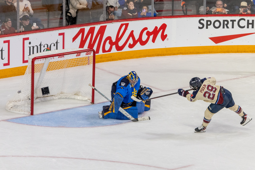 Montreal Victoire's Marie-Philip Poulin (29) scores on Toronto Sceptres goaltender Raygan Kirk (1) during a shootout in PWHL Takeover Tour game in Halifax, Wednesday, Dec. 17, 2025. (Riley Smith/The Canadian Press via AP)