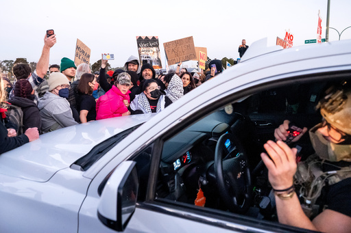 Protesters block a caravan of U.S. Border Patrol personnel from entering Coast Guard Base Alameda on Thursday, Oct. 23, 2025, in Oakland, Calif. (AP Photo/Noah Berger) Protesters block a caravan of U.S. Border Patrol personnel from entering Coast Guard Base Alameda on Thursday, Oct. 23, 2025, in Oakland, Calif. (AP Photo/Noah Berger)