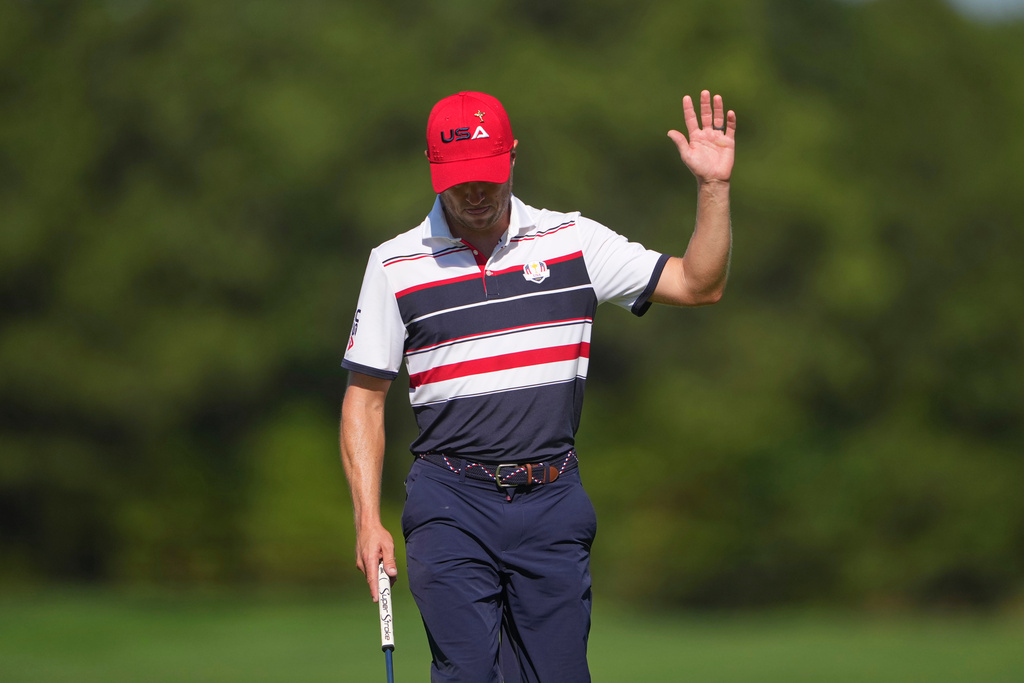 United States' Justin Thomas waves after making a putt on the 12th hole during their singles match on the Bethpage Black golf course at the Ryder Cup golf tournament, Sunday, Sept. 28, 2025, in Farmingdale, N.Y. (AP Photo/Lindsey Wasson)