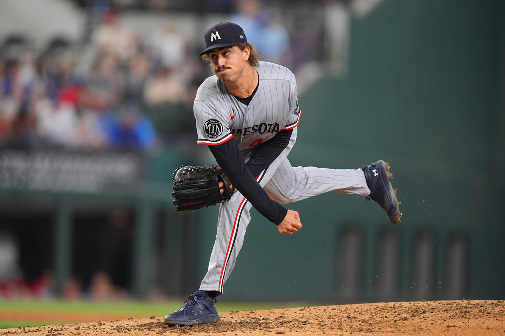 Minnesota Twins starting pitcher Joe Ryan follows through on a throw during the third inning of a baseball game against the Texas Rangers, Thursday, June 18, 2026, in Arlington, Texas. (AP Photo/LM Otero)