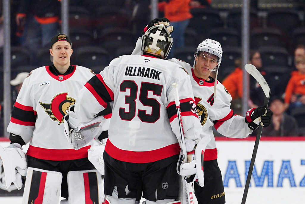 Ottawa Senators' Tim Stützle, right, celebrates an overtime win with goaltender Linus Ullmark (35) following an NHL hockey game against the Philadelphia Flyers, Saturday, Nov. 8, 2025, in Philadelphia. (AP Photo/Derik Hamilton)