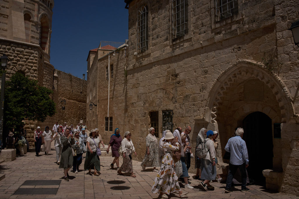 Christian pilgrims visit the Cenacle, traditionally believed to be the site of the Last Supper, in Jerusalem, Friday, May 1, 2026, as they walk past the site where a nun was attacked by a man last Wednesday. (AP Photo/Leo Correa)