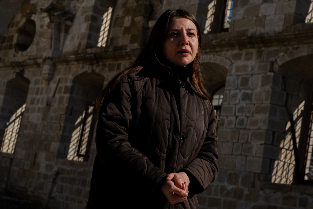 Buse Ceren Gul, a 34 year-old Antakyan architect, speaks to the Associated press in Antakya, southern Turkey, Wednesday, Feb. 4, 2026. (AP Photo/Murat Kocabas)