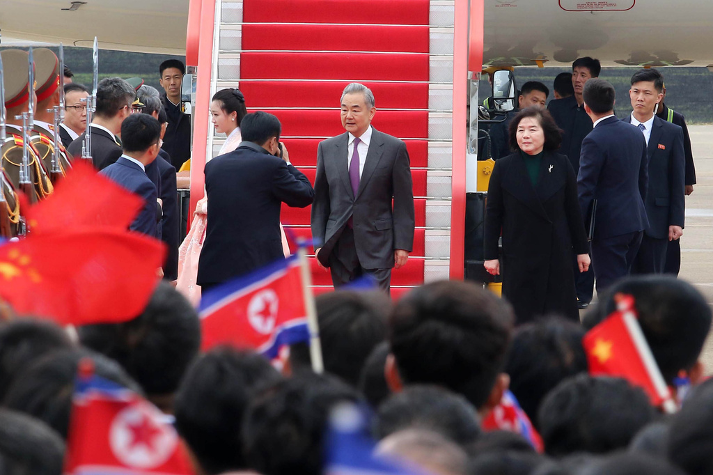 Chinese Foreign Minister Wang Yi, center, arrives at the Pyongyang International Airport in Pyongyang, North Korea Thursday, April 9, 2026. North Korean Foreign Minister Choe Son Hui is seen at right. (AP Photo/Jon Chol Jin)