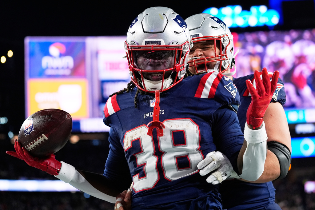 New England Patriots running back Rhamondre Stevenson celebrates after scoring a touchdown during the second half of an NFL football game against the Miami Dolphins in Foxborough, Mass., Sunday, Jan. 4, 2026. (AP Photo/Robert F. Bukaty)