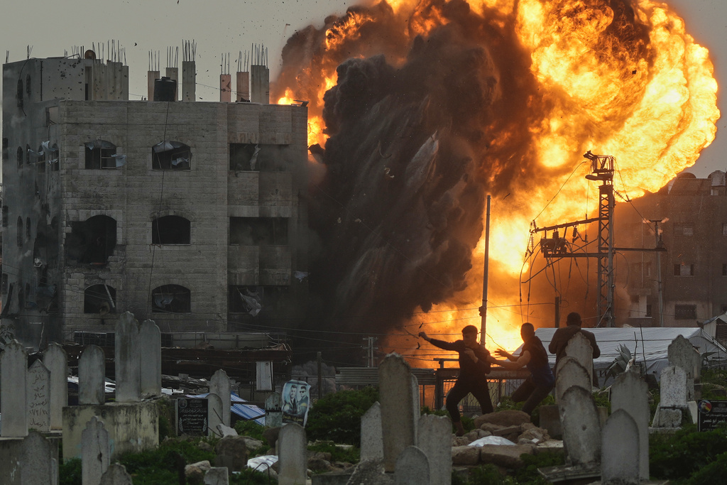 Smoke and flames rise from an Israeli military strike on a building in the Zeitoun neighborhood of Gaza City, Friday, Feb. 6, 2026. (AP Photo/Jehad Alshrafi)