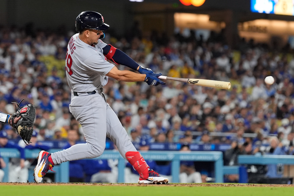 St. Louis Cardinals' Ramón Urías hits a RBI single during the third inning of a baseball game against the Los Angeles Dodgers, Thursday, Sept. 3, 2026, in Los Angeles. (AP Photo/Mark J. Terrill)