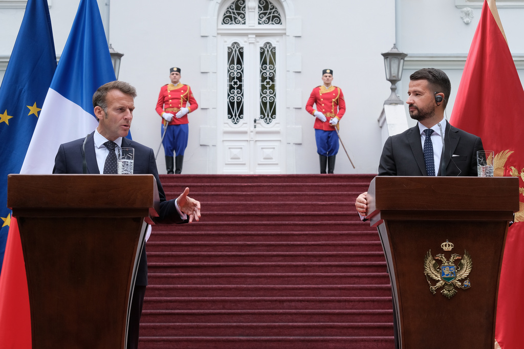 French President Emmanuel Macron, left, speaks during a press conference after talks with Montenegro's President Jakov Milatovic, right, in Cetinje, Montenegro, Thursday, June 4, 2026. (AP Photo/Risto Bozovic)
