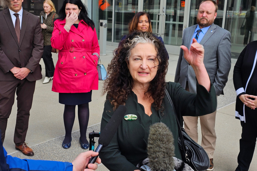 Attorney Amanda Cialkowski speaks with reporters outside the federal courthouse in St. Paul, Minn., Wednesday, April 8, 2026, after a hearing on a lawsuit by the Fridley and Duluth school districts and the Education Minnesota teachers union that seeks to block a Trump administration change in policy that gave immigration authorities a freer hand to conduct enforcement actions in and near schools. (AP Photo/Steve Karnowski)