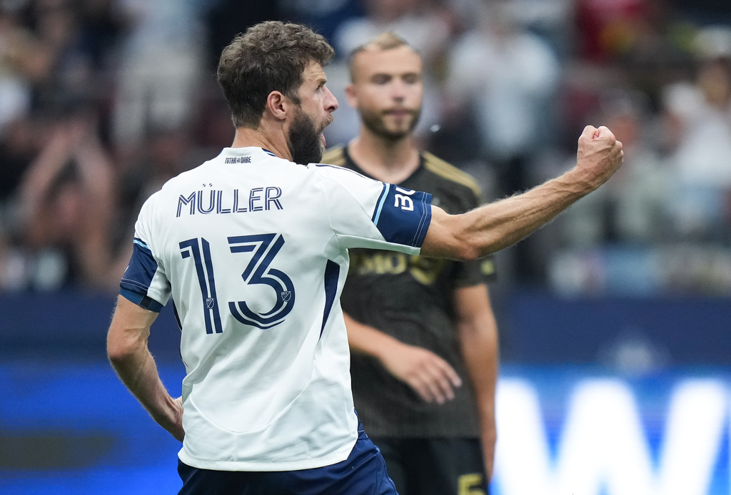 Vancouver Whitecaps' Thomas Muller (13) celebrates his penalty kick goal during the second half of an MLS soccer match against Los Angeles FC, in Vancouver, on Saturday, Aug. 1, 2026. (Darryl Dyck/The Canadian Press via AP)