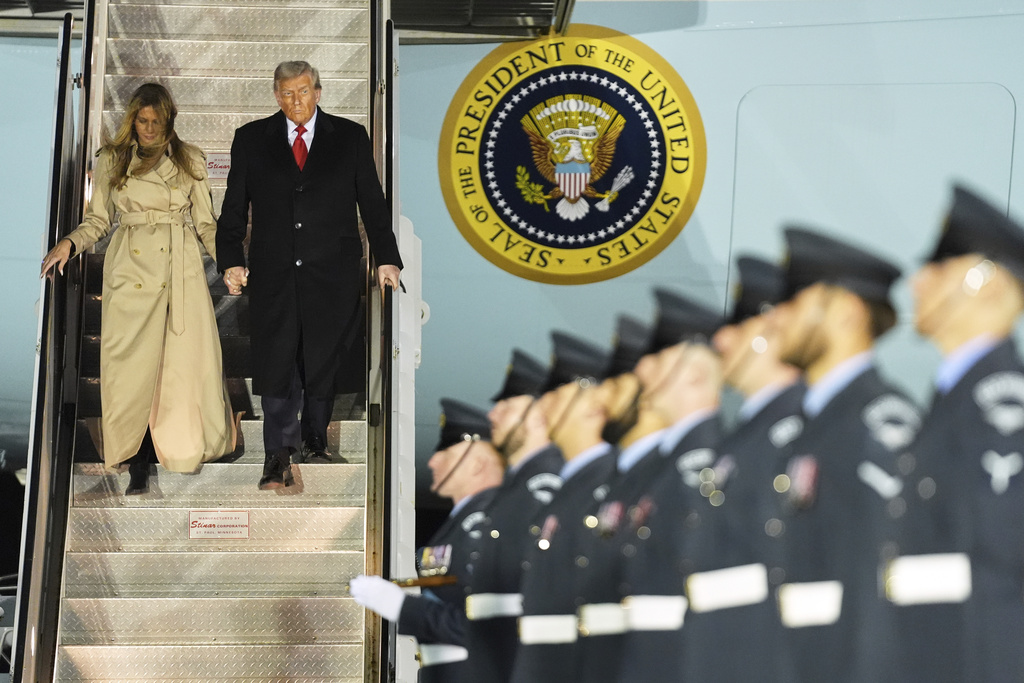 President Donald Trump and first lady Melania Trump exit Air Force One as they arrive at Stansted Airport near London, Tuesday, Sept. 16, 2025. (AP Photo/Evan Vucci)
