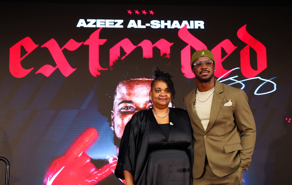 Houston Texans' Azeez Al-Shaair poses with his mother Naadhirah Lennon during a press conference at the NFL football team's facility, Friday, May 1, 2026, in Houston. (AP Photo/Karen Warren)