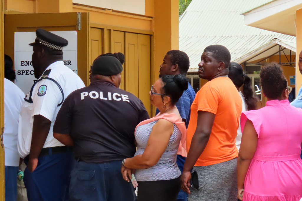 People line up to cast their votes at the English River School in Victoria, Seychelles, Thursday, Sept. 25, 2025. (AP Photo/Emilie Chetty)