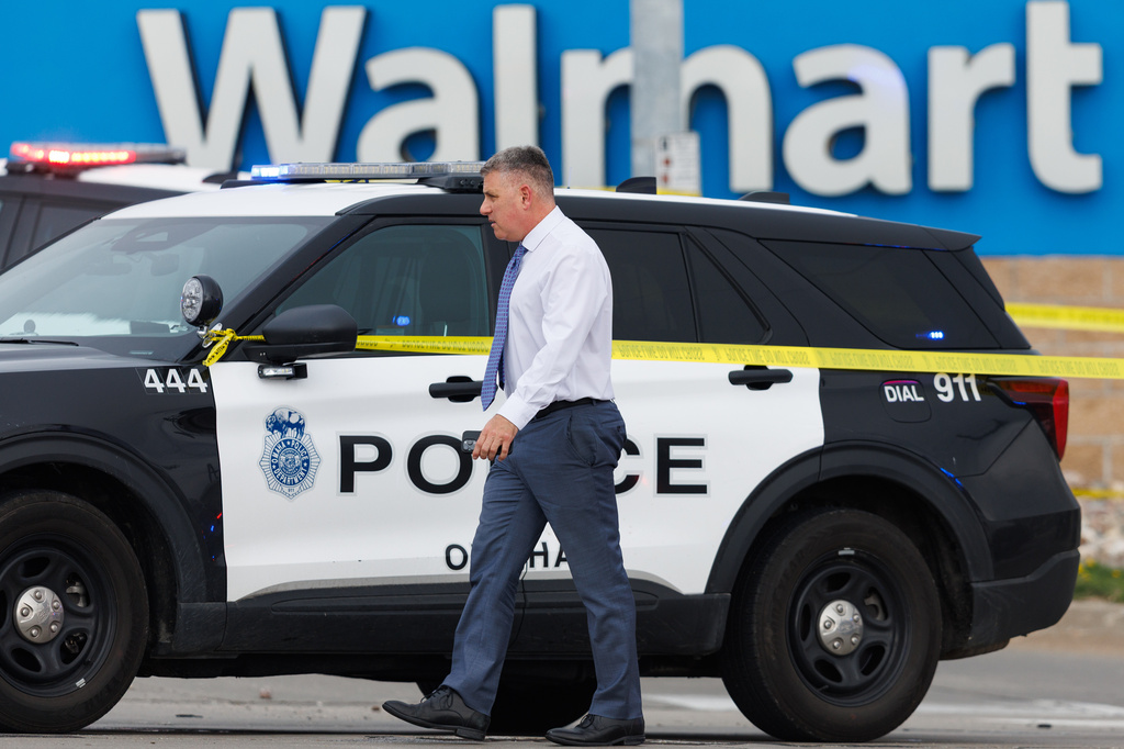 Omaha Police Chief Todd Schmaderer arrives at a Walmart store at South 72nd and Pine Streets in Omaha, Neb., on Tuesday, April 14, 2026, after police fatally shot a woman who was accused of cutting a young child's face with a knife. (Nikos Frazier/Omaha World-Herald via AP)