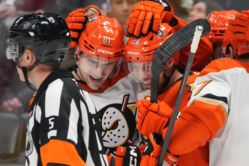 Anaheim Ducks left wing Cutter Gauthier, left, congratulates left wing Jeffrey Viel after his goal agaist the Colorado Avalanche in the second period of an NHL hockey game Wednesday, Jan. 21, 2026, in Denver. (AP Photo/David Zalubowski)