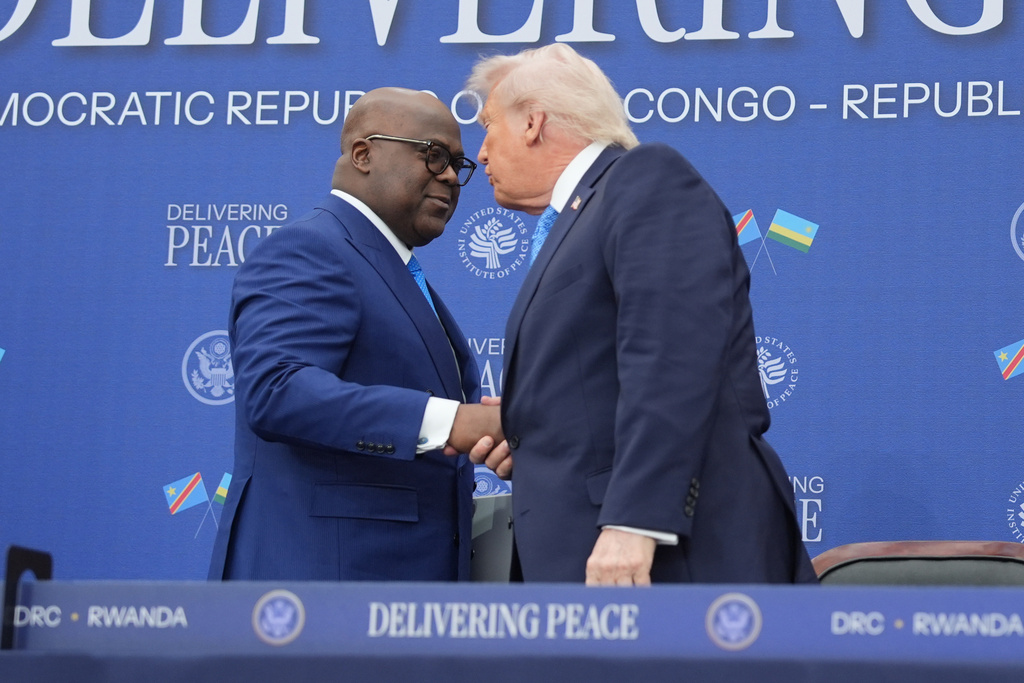 FILE - President Donald Trump greets Democratic Republic of the Congo President Felix Tshisekedi at the U.S. Institute of Peace, Dec. 4, 2025, in Washington. (AP Photo/Evan Vucci, File)