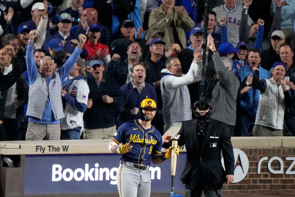 Milwaukee Brewers' Jake Bauers reacts after striking out with bases loaded during the eighth inning of Game 3 of baseball's National League Division Series against the Chicago Cubs Wednesday, Oct. 8, 2025, in Chicago. (AP Photo/Nam Huh)
