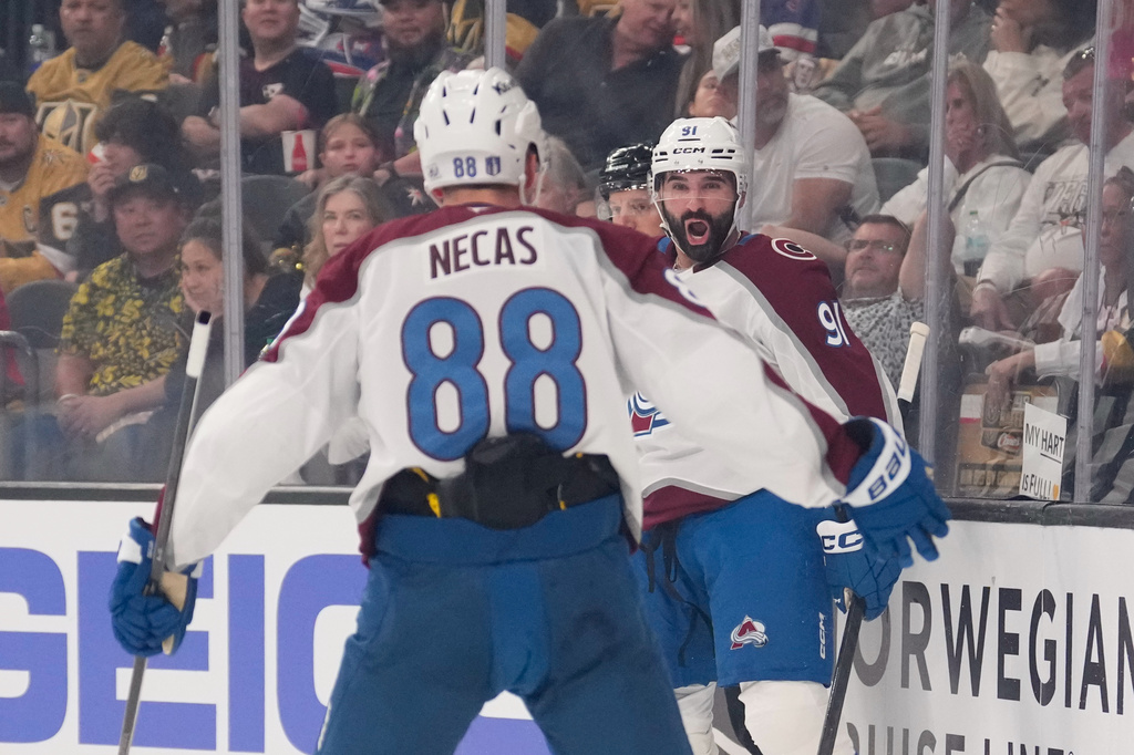 Colorado Avalanche center Nazem Kadri, right, celebrates his goal with center Martin Necas during the first period in Game 3 of the Western Conference finals NHL hockey Stanley Cup playoff series against the Vegas Golden Knights, Sunday, May 24, 2026, in Las Vegas. (AP Photo/Mark J. Terrill)