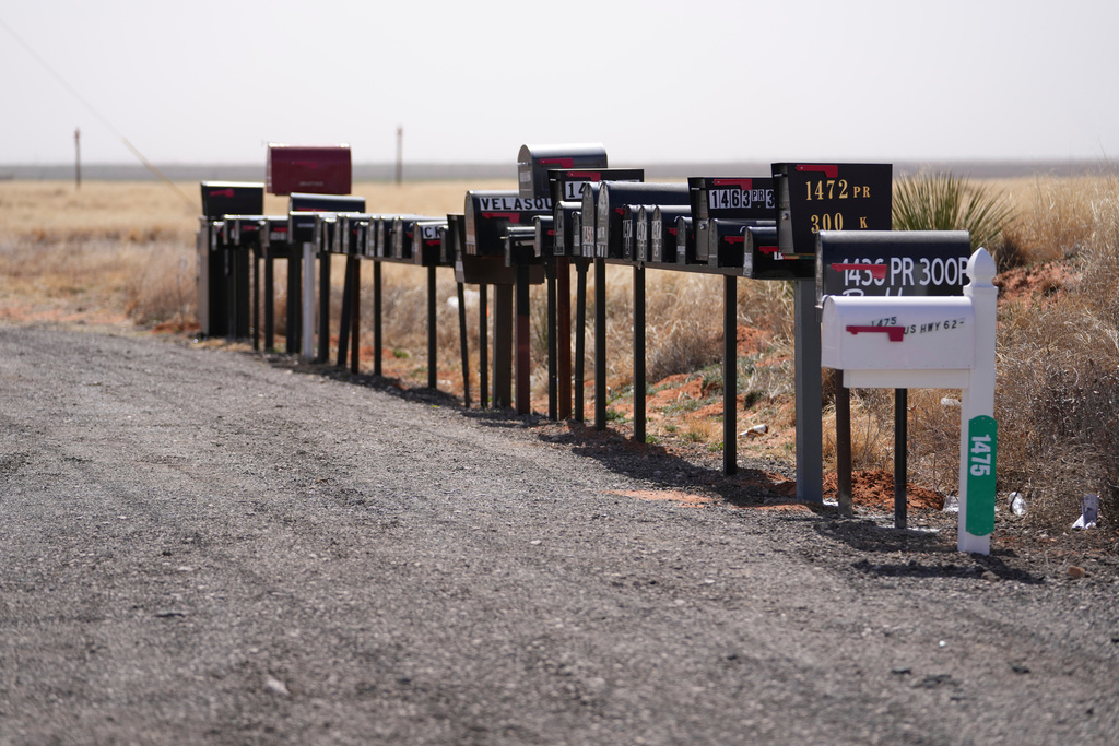 FILE - Mailboxes are seen lined up together near Route 180 Feb. 26, 2025, in Seminole, Texas. (AP Photo/Julio Cortez, File)