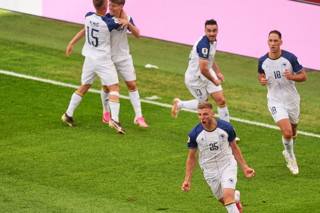 Bosnia's Jovo Lukic (25) celebrates after scoring the opening goal during the World Cup Group B soccer match between Canada and Bosnia in Toronto, Friday, June 12, 2026. (AP Photo/Jared Freed)