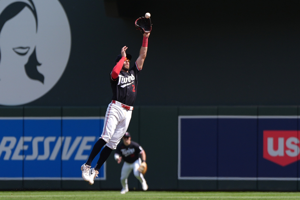 Minnesota Twins second baseman Kody Clemens (2) catches a line out hit by Baltimore Orioles' Jackson Holliday during the seventh inning of a baseball game Wednesday, Aug. 12, 2026, in Minneapolis. (AP Photo/Abbie Parr)