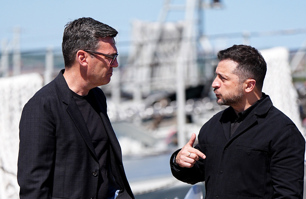 Britain's Prime Minister Andy Burnham, left, and Ukraine's President Volodymyr Zelenskyy view Ukrainian equipment and meet Ukrainian personnel at HM Naval Base in Portsmouth, England, Monday July 27, 2026. (Aaron Chown/Pool Photo via AP)