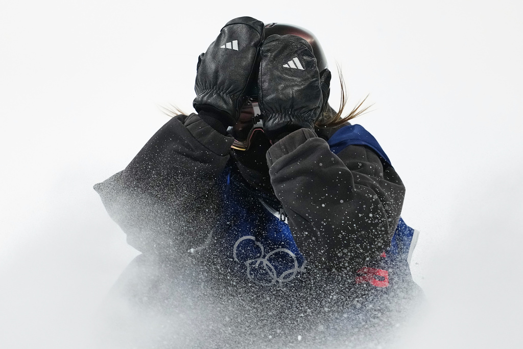 Britain's Mia Brookes reacts during the women's snowboarding big air finals at the 2026 Winter Olympics, in Livigno, Italy, Monday, Feb. 9, 2026. (AP Photo/Lindsey Wasson)