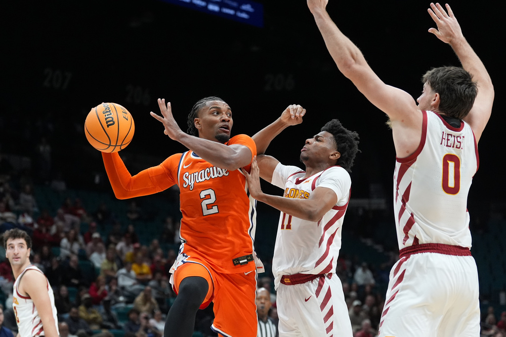 Syracuse guard JJ Starling (2) drives against Iowa State guard Dominick Nelson (11) and guard Nate Heise (0) during the second half of an NCAA college basketball game in the Players Era tournament in Las Vegas, Wednesday, Nov. 26, 2025. (AP Photo/Eric Gay)