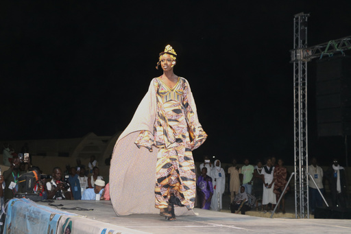 A model walks the runway during a fashion show for peace in Timbuktu, northern Mali, Wednesday, Oct. 22, 2025, (AP Photo/Moulaye Sayah ) A model walks the runway during a fashion show for peace in Timbuktu, northern Mali, Wednesday, Oct. 22, 2025, (AP Photo/Moulaye Sayah )