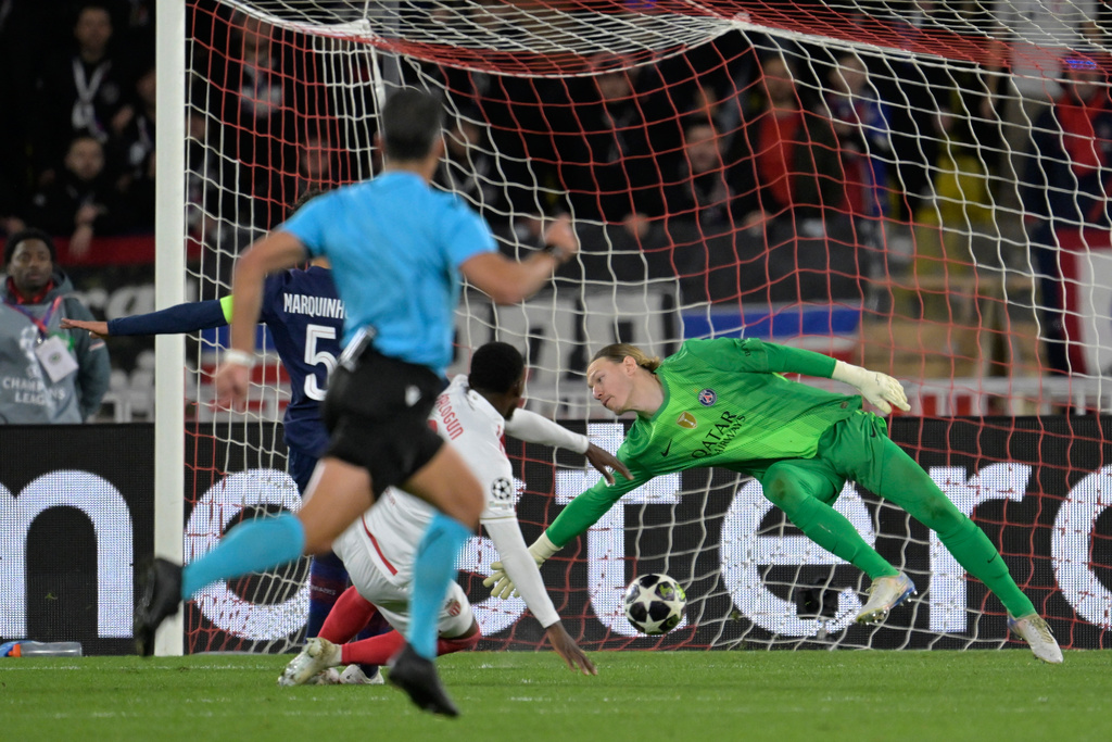 Monaco's Folarin Balogun scores his side's second goal during the first-leg of the Champions League playoff soccer match between Monaco and Paris Saint-Germain in Monaco, Tuesday, Feb. 17, 2026. (AP Photo/Philippe Magoni)