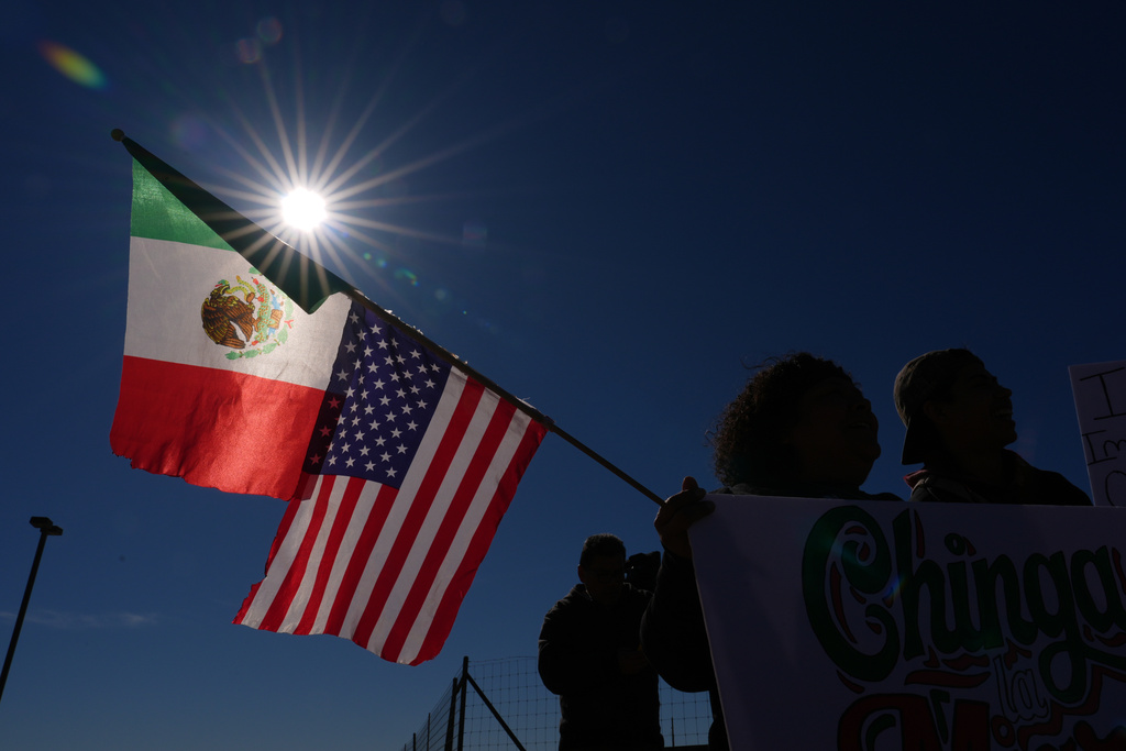Protesters gather outside the South Texas Family Residential Center detention facility where Liam Ramos and his father are being detained in Dilley, Texas, Wednesday, Jan. 28, 2026. (AP Photo/Eric Gay)