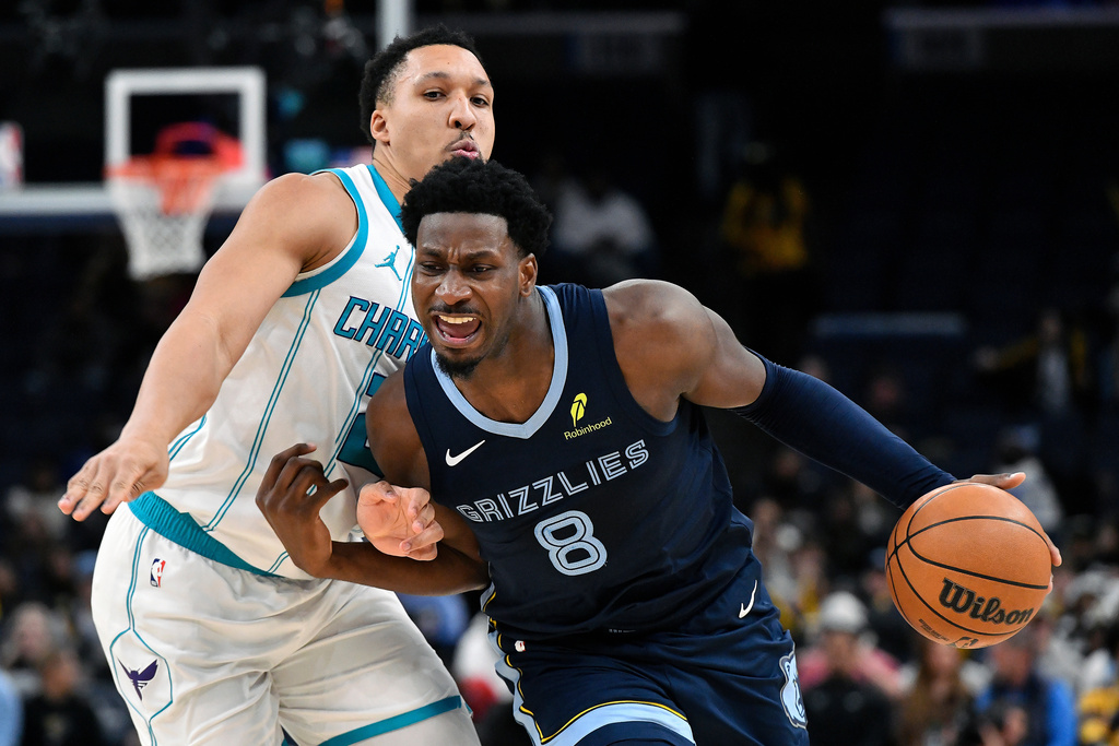 Memphis Grizzlies forward Jaren Jackson Jr. (8) handles the ball against Charlotte Hornets forward Grant Williams (2) in the second half of an NBA basketball game Wednesday, Jan. 28, 2026, in Memphis, Tenn. (AP Photo/Brandon Dill)