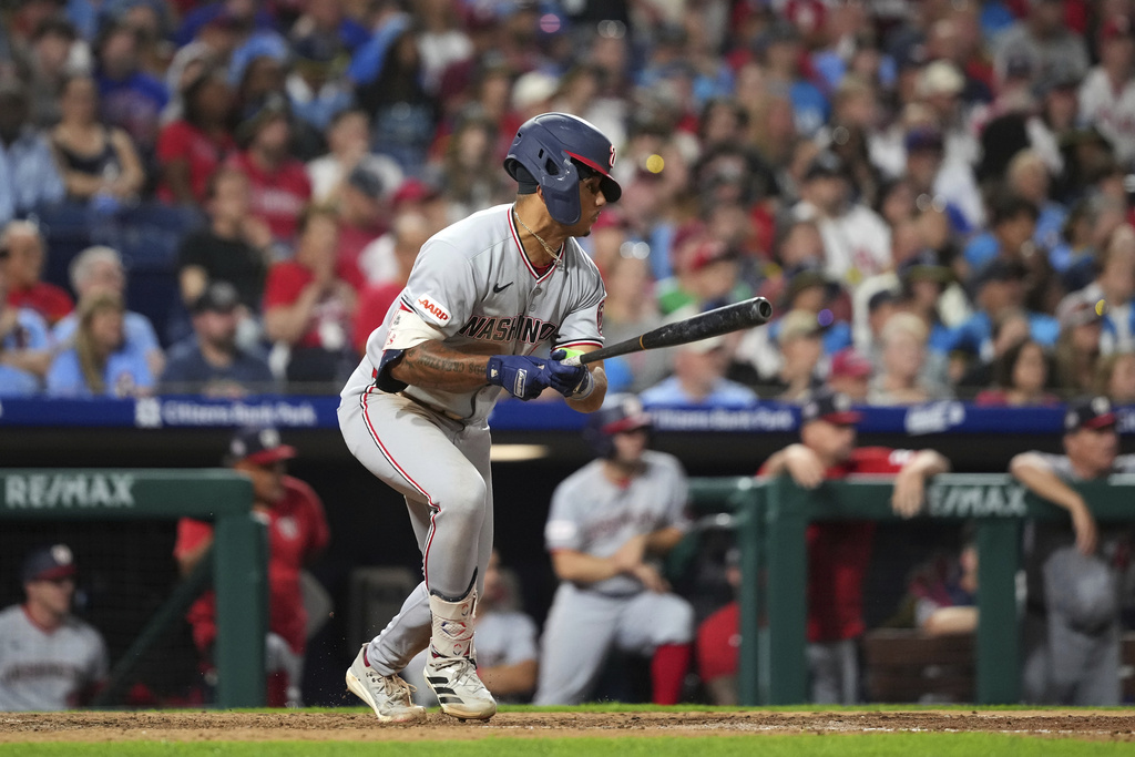 Washington Nationals' Daylen Lile watches after hitting a run-scoring single against Philadelphia Phillies pitcher Jhoan Duran during the ninth inning of a baseball game Friday, Aug. 22, 2025, in Philadelphia. (AP Photo/Matt Slocum)