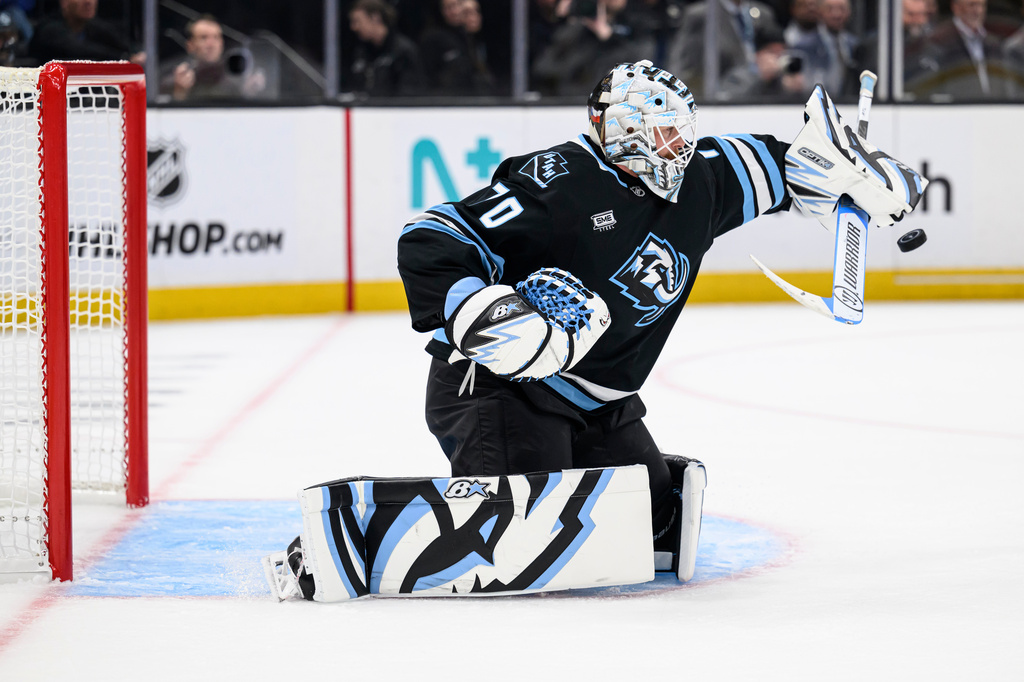 Utah Mammoth goaltender Karel Vejmelka blocks the puck with his stick during the second period of Game 4 of a first-round NHL hockey Stanley Cup playoff series against the Vegas Golden Knights, Monday, April 27, 2026, in Salt Lake City. (AP Photo/Tyler Tate)