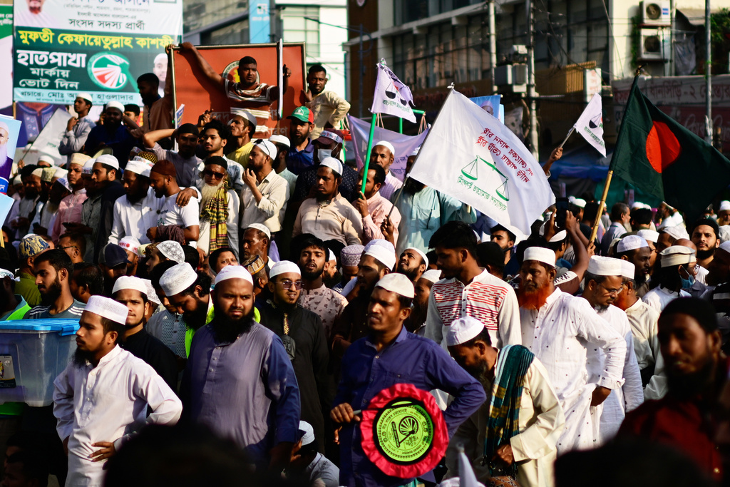 Supporters of Bangladesh's Jamaat-e-Islami and seven allied political parties attend a rally to present their demands before the next general election, expected to be held in February, in Dhaka, Bangladesh, Tuesday, Nov. 11, 2025. (AP Photo/Mahmud Hossain Opu)