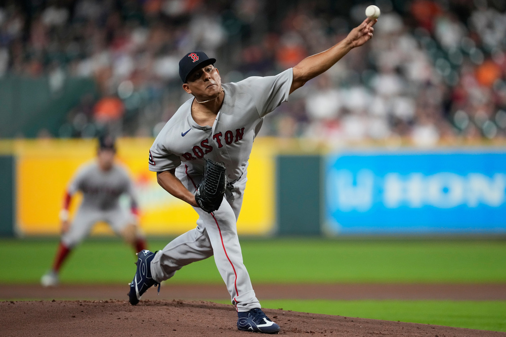 Boston Red Sox starting pitcher Ranger Suárez throws during the first inning of a baseball game against the Houston Astros in Houston, Monday, March 30, 2026. (AP Photo/Ashley Landis)